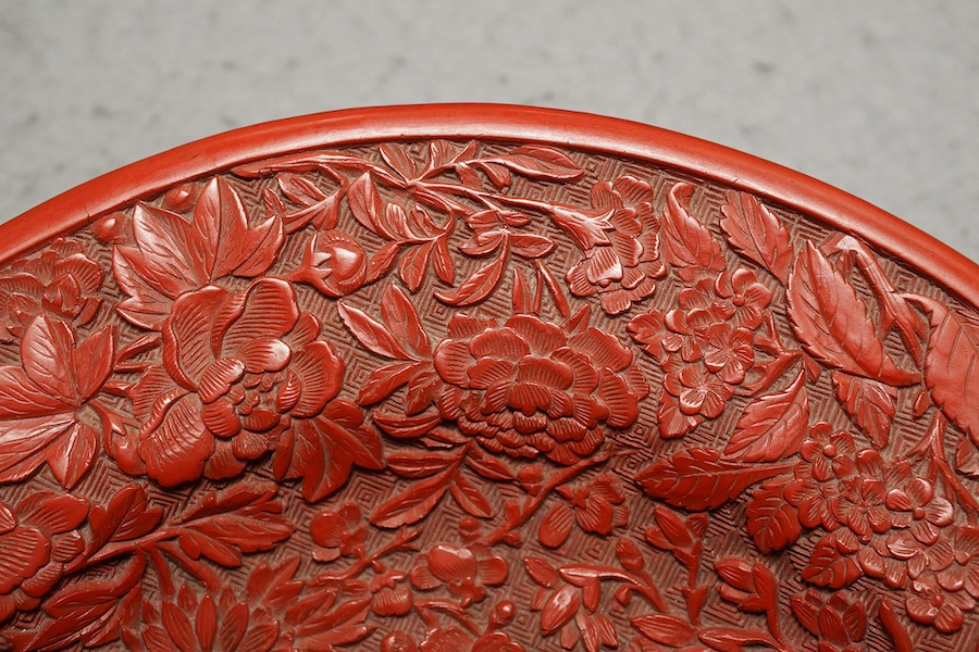 An unusual Chinese cinnabar lacquer ‘thousand flower’ footed dish, 18th/19th century